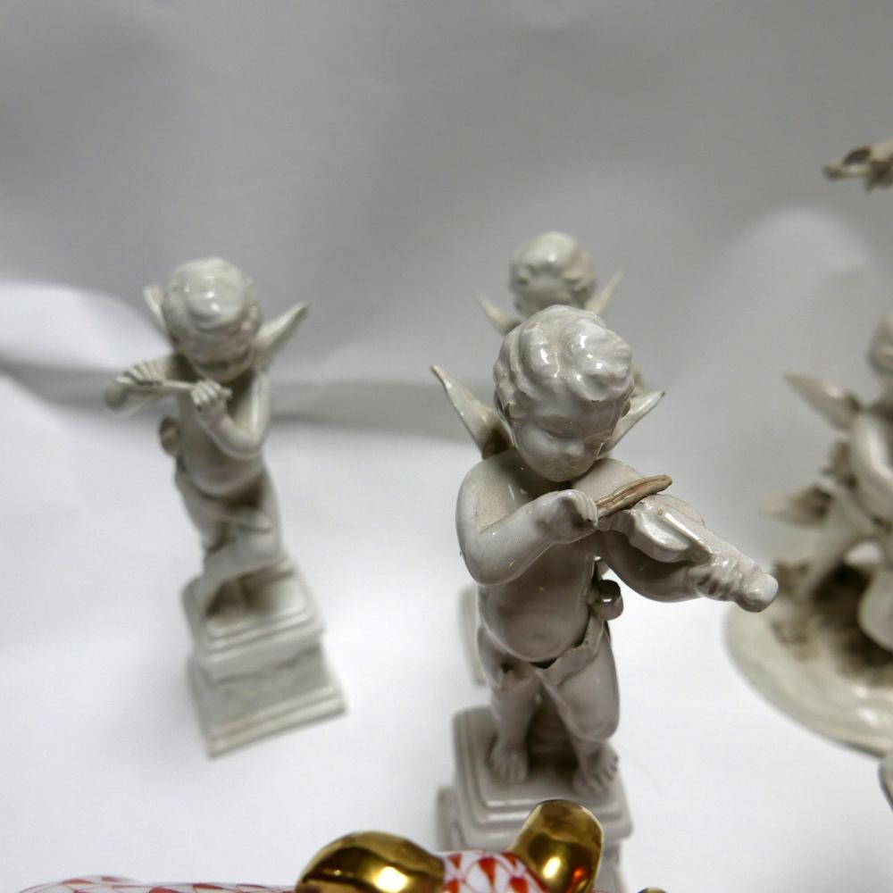 A collection of Capodimonte white glazed cherubs, each playing musical instruments, consisting of - Image 2 of 3