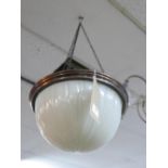 An early 20th century opaque glass ceiling light shade with copper fittings