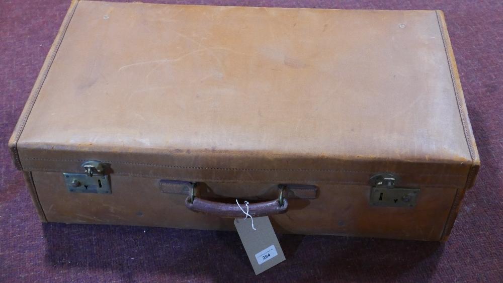 A vintage Harrods tan leather suitcase