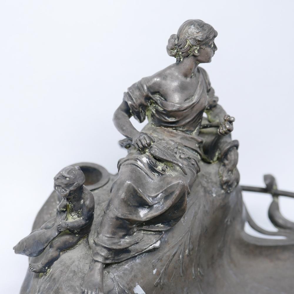 A 19th century silver plated inkstand/dish with mother and child rowing a boat finial having - Image 2 of 4