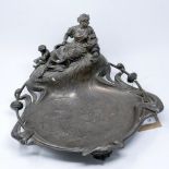 A 19th century silver plated inkstand/dish with mother and child rowing a boat finial having