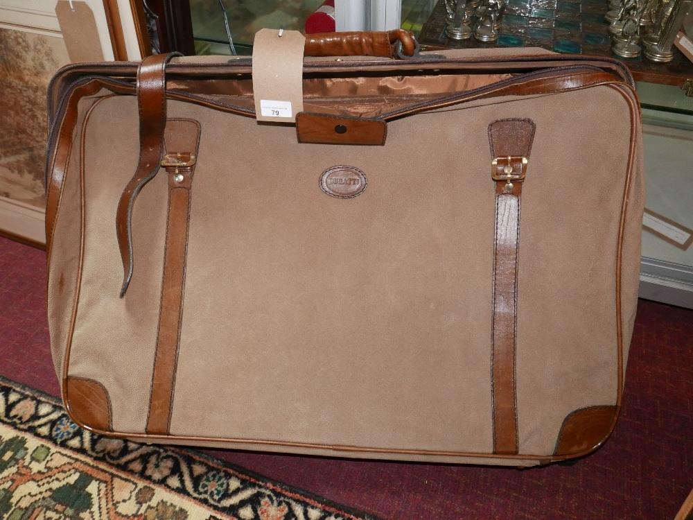 A pigskin Bugatti suitcase with strap fastening H.48 L.73cm