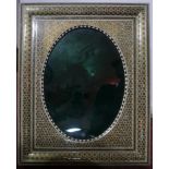 A large Persian photograph frame inlaid and handpainted with small stars and geometric forms, (green