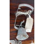A cast metal wall mounted bell