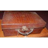 A late 19th/early 20th century crocodile skin travelling vanity case, inscribed J.C Vickery, to