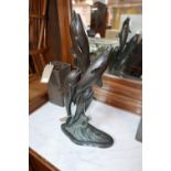 A cast bronze sculpture of four jumping dolphins, H.58cm