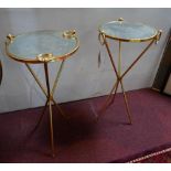 A pair of gilt metal lamp tables, with circular mirrored tops on tripod bases, H.77cm Diameter 38cm