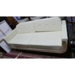 A contemporary cream leather sofa, button back cushions, on splayed legs, H.77 W.177 D.78cm