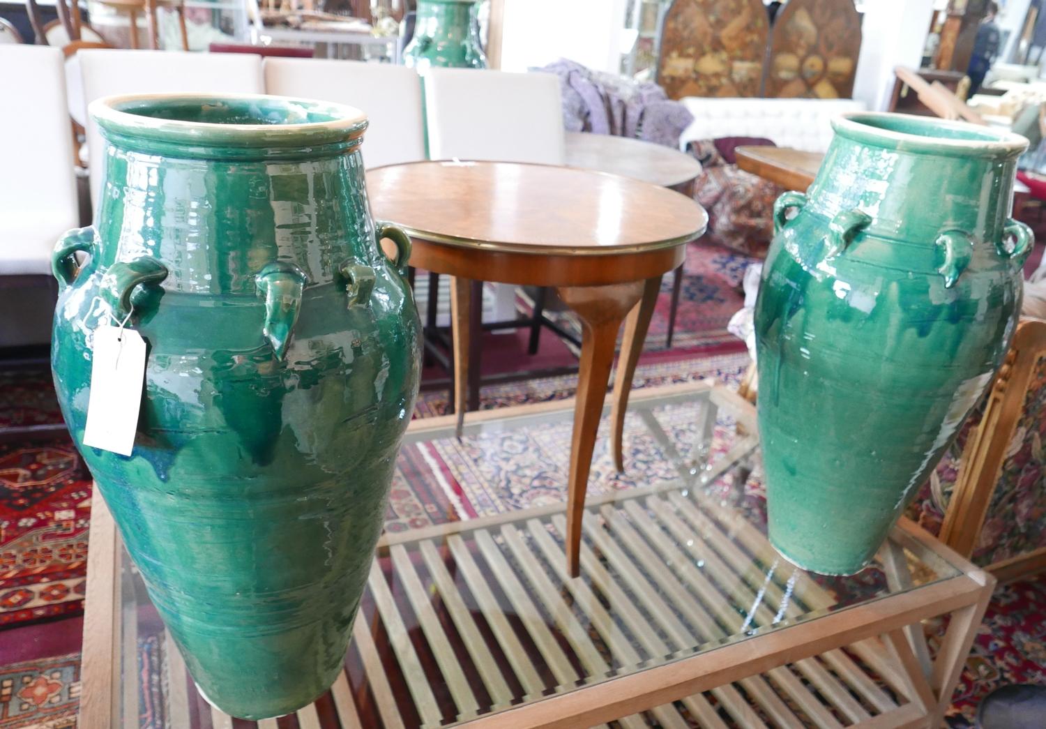 A pair of Persian green glazed Sharab wine vessels, H.80cm (2)