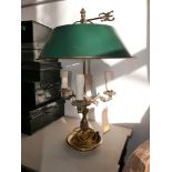 A brass 3 branch desk lamp in the rococo style with a single green metal shade. H.58cm