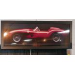 A printed posted of a 1958 Ferrari Testarossa, framed and glazed, 50 x 149cm