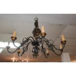 A large wrought iron 8 branch candelabra, 85cm diameter