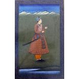 An Indian Mughal watercolour of a young nobleman in a landscape scene, within floral mount, framed