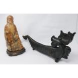 A Chinese carved horn sculpture of a robed sage with staff on a fitted hardwood base, 27.5 x 14cm,