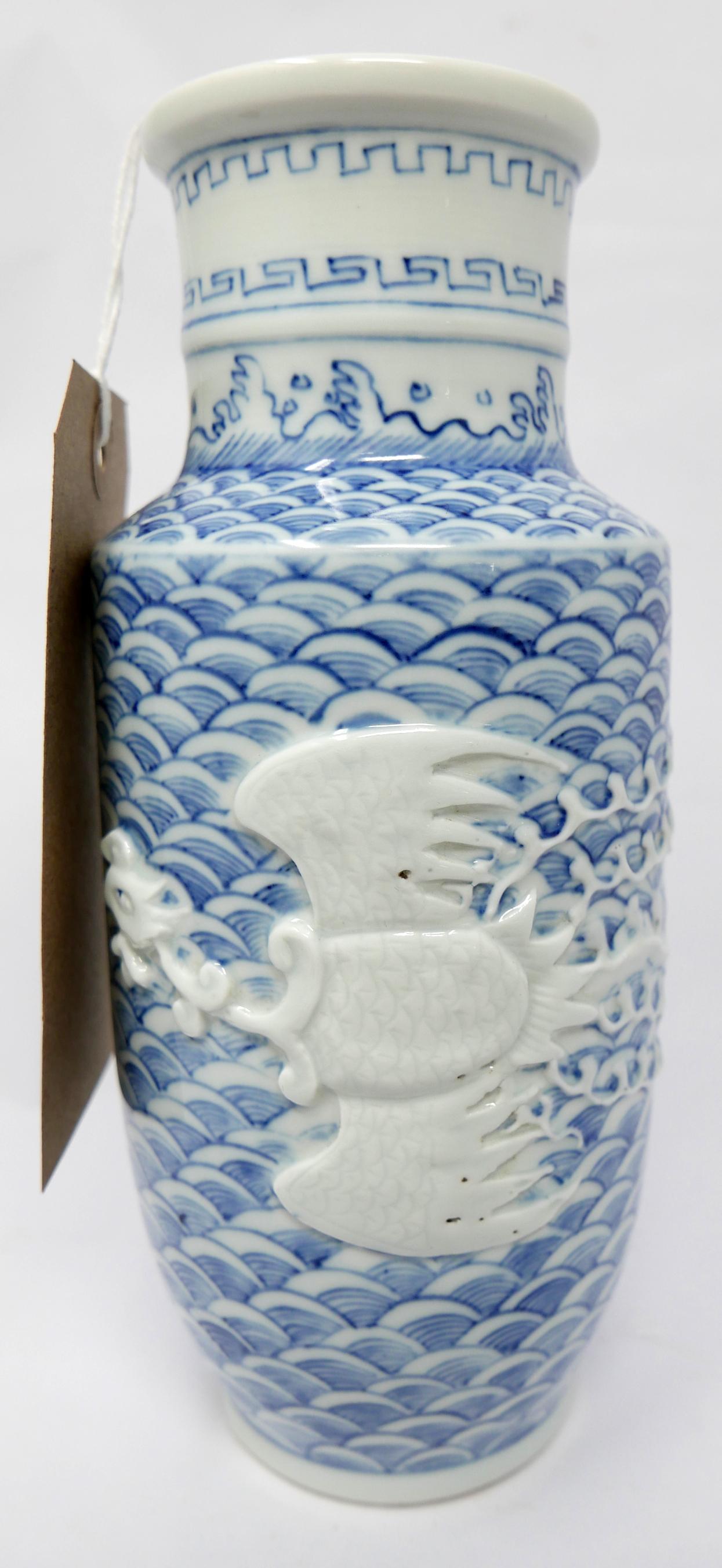 An early 20th century, Chinese, porcelain vase handpainted with a blue scaled ground adorned with an