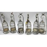 A set of six candle lanterns in the form of bird cages, on stands, H.53cm (6)