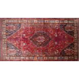 A South West Persian Qashqai carpet, central diamond medallion with four corner medallions with
