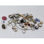 A large collection of silver and costume jewellery rings, many gem-set with a Swarovski-crystal