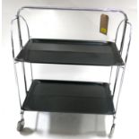 A vintage chrome folding drinks trolley with laminate shelves