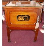 An early 20th century mahogany and chinoiserie bedside panelled cupboard, with glass top, single