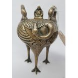 A Chinese bronzed lidded pot of stylised crane design standing on three tall bird's feet and the lid