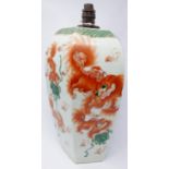 A large Chinese, hand-painted porcelain lamp of hexagonal form decorated with playful orange dogs