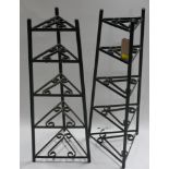 A pair of black painted metal pan stands of graduating size, H.84cm