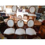 A set of 10 Continental style dining chairs with upholstered oval backs. H.98cm