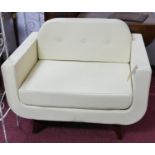 A contemporary cream leather armchair, button back cushion, on splayed legs, H.76 W.99 D.78cm