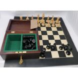 A chess set in a mahogany box, together with a chessboard, 56 x 56cm