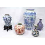 A collection of five vases to include three Chinese ceramic examples (one on a hardwood stand), a