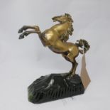 A bronze of a rearing horse, on hardstone base, H.27cm