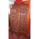 Three carved teak Eastern panels, H.215cm