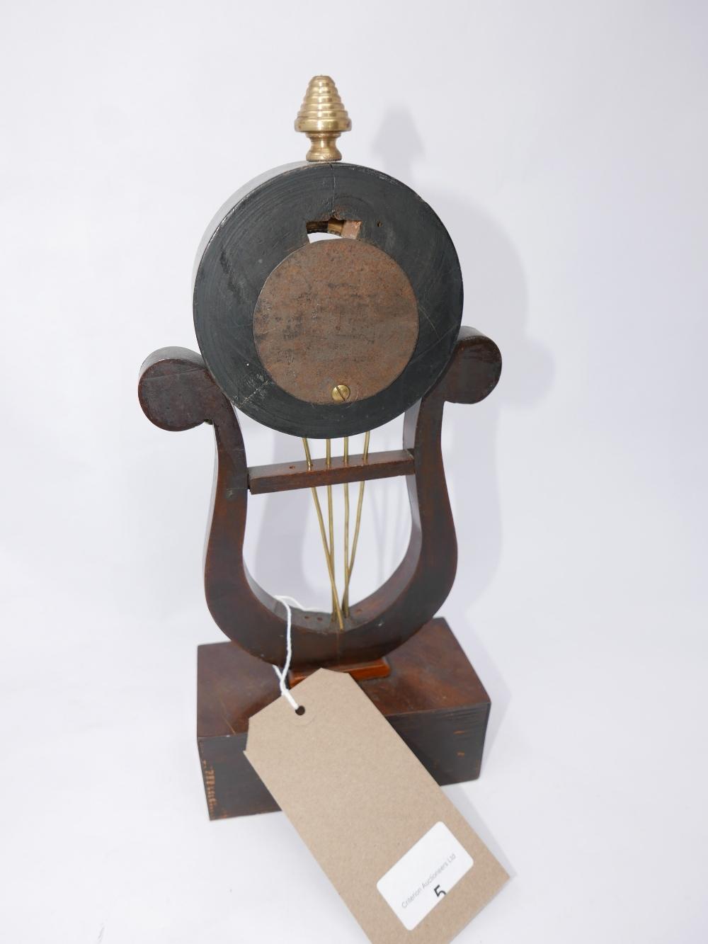 A mahogany and brass mounted harp shaped watch stand, on rectangular block base, with brass floral - Image 2 of 2