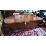 An early 20th century cherrywood drop leaf dining table, on tapered legs and pad feet, H.78 L.210cm