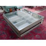 A modern glass topped coffee table fitted drawer beneath. H.29 W.120 D.120cm