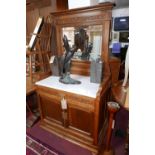 A 19th century Continental carved walnut marble topped mirror backed washstand, H.167 W.88 D.55cm