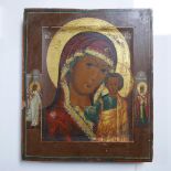 A Russian icon of the Mother of God of Kazan, with an angel and saint to border, tempera on wood