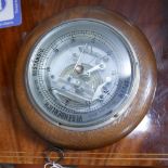 WITHDRAWN- A German oak cased barometer, marked MO CO to reverse, D.22cm