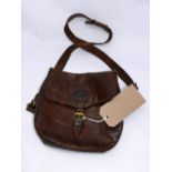 A vintage brown leather Mulberry handbag, the exterior strap fastening stamped with the mulberry