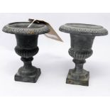 A pair of 19th century miniature lead urns, H.13cm