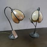 Two of Art Nouveau style table lamps, with floral shades on lily pad moulded base, one having two