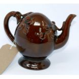 A Copeland Cadogan Trelle glazed teapot, decorated with foliage, marked to base, H.16.5cm, small