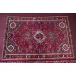 A South West Persian Qashqai carpet, triple pole medallion with repeating animal and petal motifs on