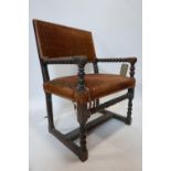 A 19th century oak armchair with bobbin turned supports