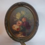 A Dutch oval oil on panel depicting a still life of roses, signed Voun Ryck (?), in gilt frame, 48 x