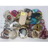 A large quantity of costume jewellery bracelets and bangles.