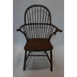 A late 19th century Windsor chair, with stick back on turned legs joined by stretchers