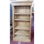 A contemporary reclaimed pine open bookcase, with adjustable shelves, raised on stepped base, H.