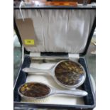 A boxed vintage dressing table set to include a silver plated and faux tortoiseshell hand mirror